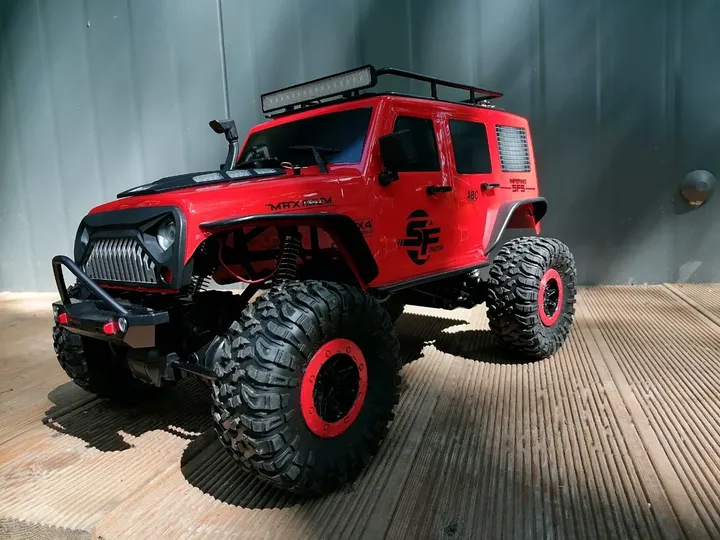 Jeep Rubicon красный трофи 1:10 — вид спереди слева