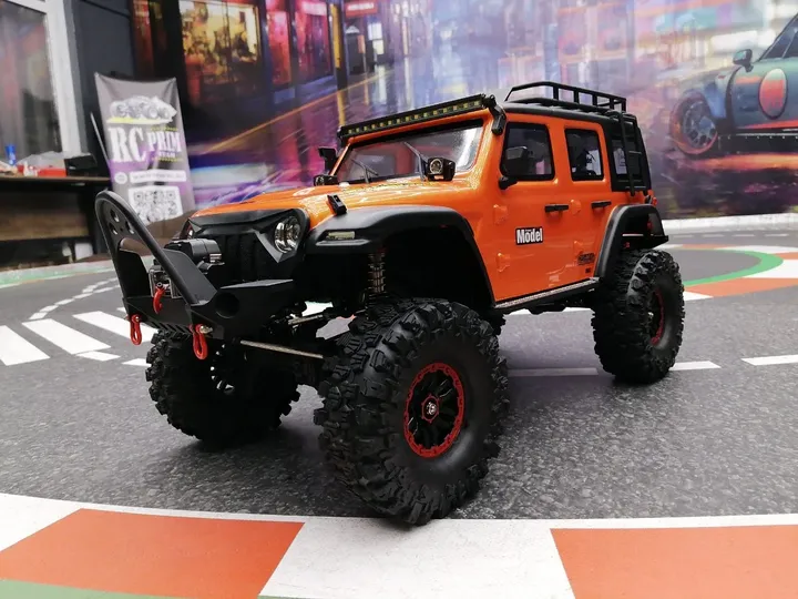 Rubicon трофи 1:10, оранжевый — вид спереди сбоку