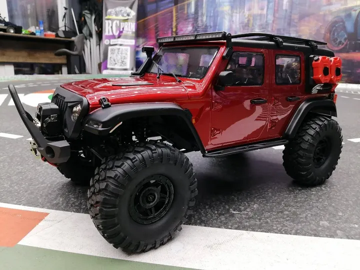Jeep Rubicon красный трофи 1:10 — вид спереди сбоку