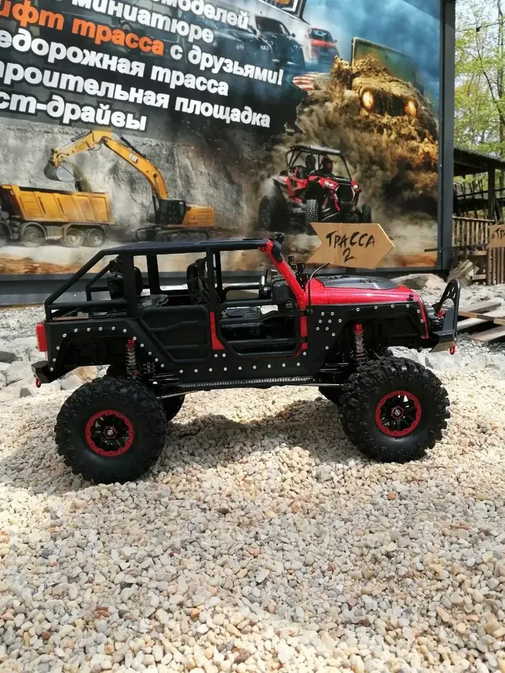Jeep Wrangler 10426 4WD 1:10 — вид сбоку на фоне плаката